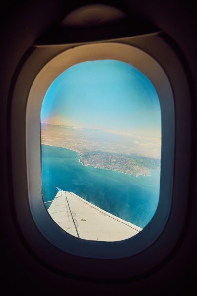 AIrplane Window Turquoise Ocean Travel