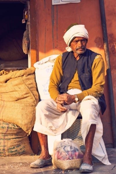 India Man Street Seller Sitting